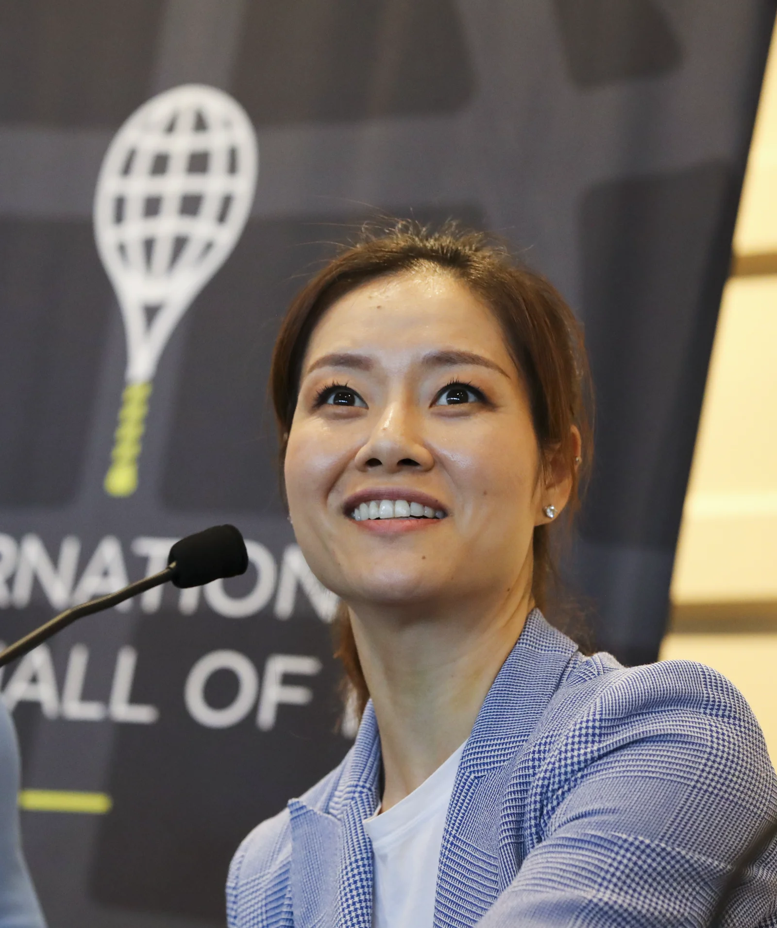 Li Na in retirement, at a tennis event