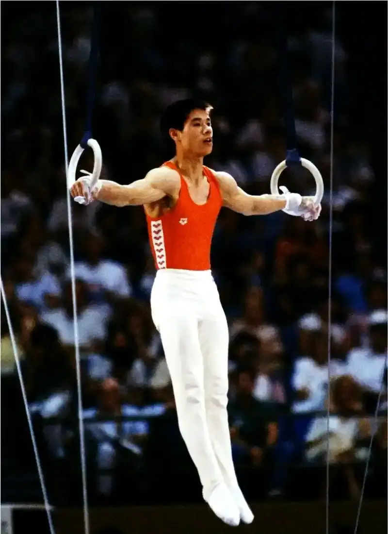 Li Ning performing on the still rings