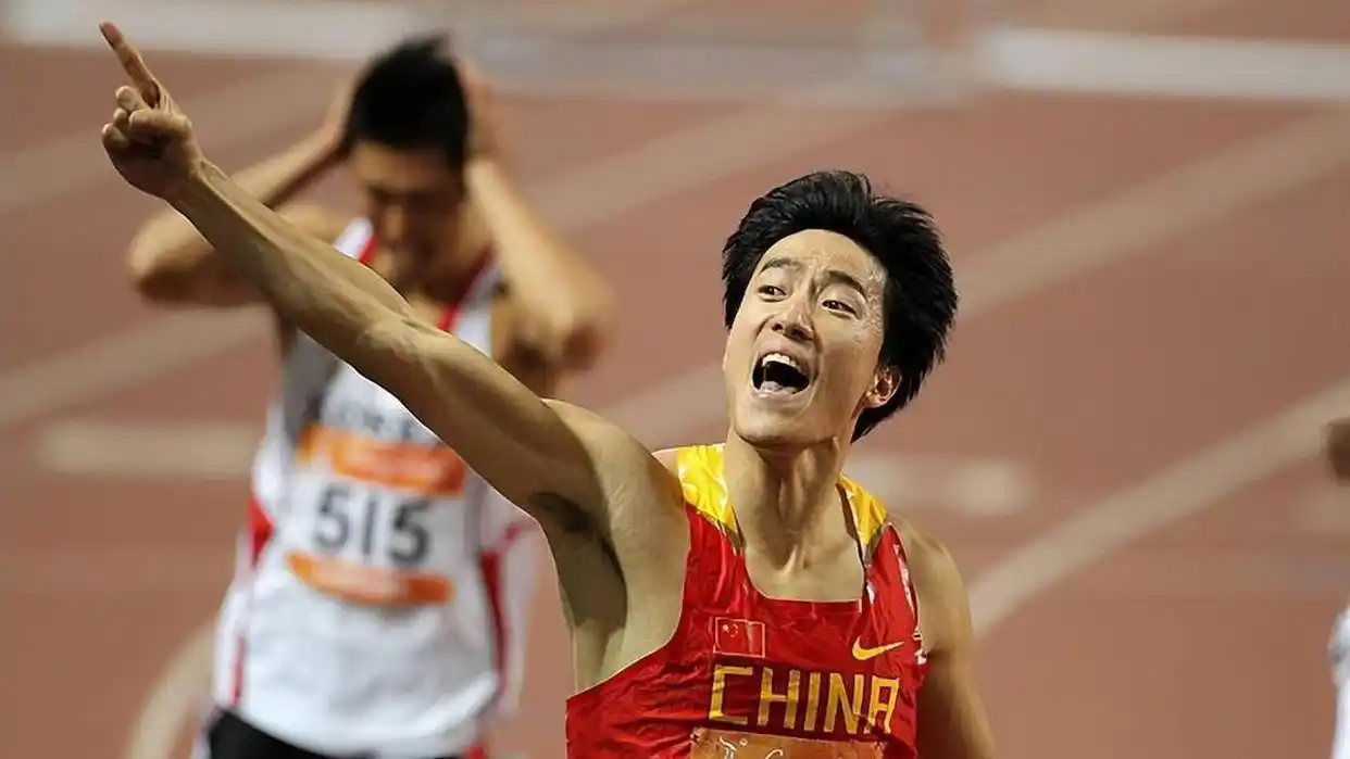 Liu Xiang crossing the finish line to win Olympic gold at Athens 2004, 12.91 seconds — world record tie