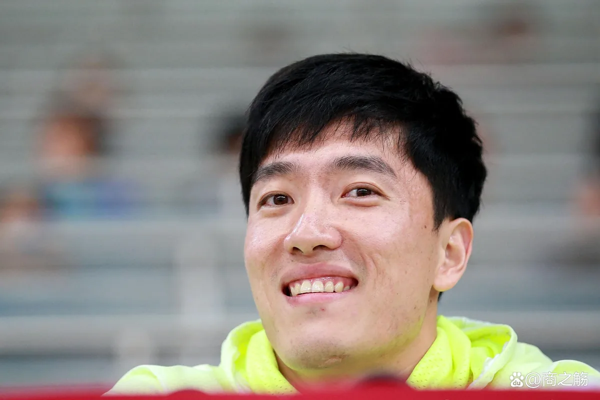 Liu Xiang smiling in a portrait years after retiring from the 110m hurdles