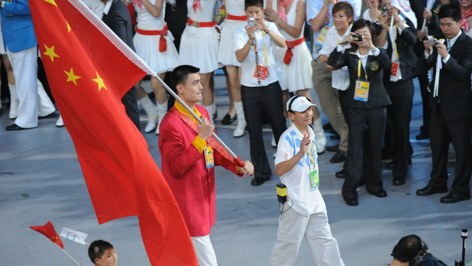 Yao Ming carrying the Chinese flag as flag bearer for China during the athletes parade at the opening ceremony of the 2008 Beijing Olympics