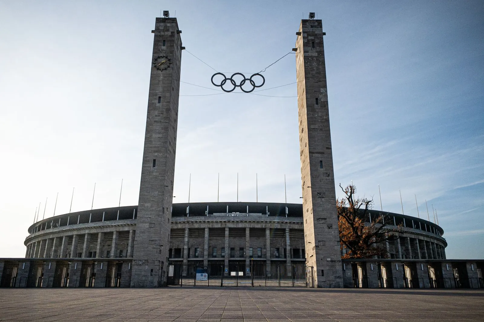 Olympic Stadium in Berlin featuring the Olympic rings between two towers